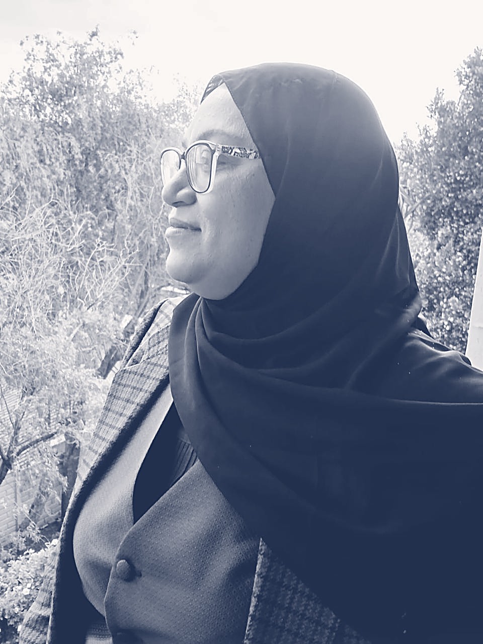Fatima in profile, looking out over the trees